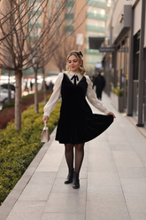 a lady in a velvet patchwork dress